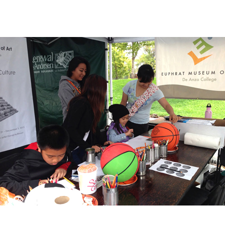Pyramid project 3, participants decorating basketballs for the pyramid